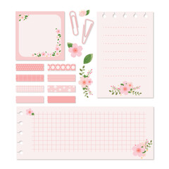 Collection of pink cherry blossoms with note paper, washi tape, paper clips