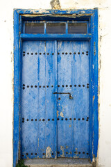 Old historical colorful doors and shutters made of wrought iron and wood. Old historical wooden doors in Cyprus. Doors and shutters of historical stone houses in Nicosia.