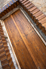 Old historical colorful doors and shutters made of wrought iron and wood. Old historical wooden doors in Cyprus. Doors and shutters of historical stone houses in Nicosia.