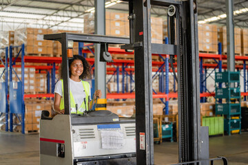 African American women smile at workers as forklift drivers are happy working in industry factory...