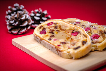 Cut open German Stollen cake, A fruit bread with nuts and dried fruits with powdered sugar traditionally served during Christmas time