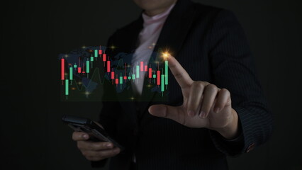 Finger pointing at market analysis with digital monitor.Businessman checking stock market data.Finance and stock exchange concept