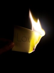Love burning by fire in the darkness.