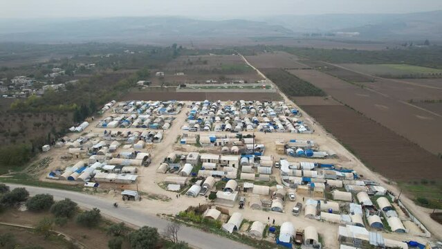 Aerial view of hundreds of tents inhabited by Syrian refugees for years due to the war that destroyed their homes.	