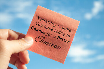 Motivational quote about yesterday is gone on sticky note with sky background. Motivational concept