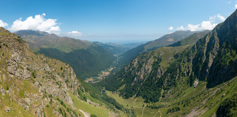 The Valley of Espone in the middle of the mountains and its green countryside , in Europe, in France, Occitanie, in the Hautes-Pyrenees, in summer, on a sunny day.