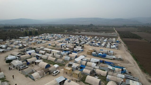 Aerial view of hundreds of tents inhabited by Syrian refugees for years due to the war that destroyed their homes.	
