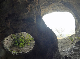 interior of a cave dug out of the rocky mountain used in the prehistoric era by primitive men as shelter