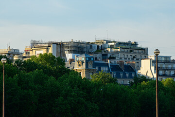 Obraz premium The Haussmann buildings of Paris , Europe, France, Ile de France, Paris, in summer on a sunny day.