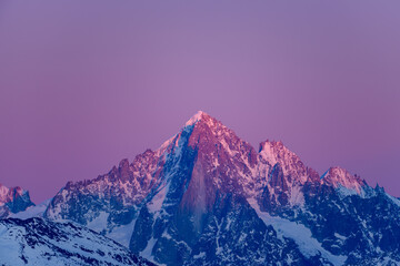 The Aiguille Verte at dusk in Europe, France, Rhone Alpes, Savoie, Alps, in winter, on a sunny day.