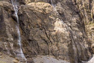 Fototapeta na wymiar The Cirque de Gavarnie waterfalls , Europe, France, Occitanie, Hautes-Pyrenees, in summer on a sunny day.