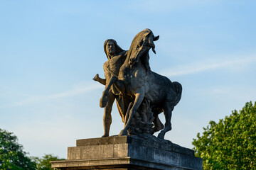 A statues of the Pont de Iéna , in Europe, in France, in Ile de France, in Paris, At the edge of the Seine, in summer, on a sunny day.