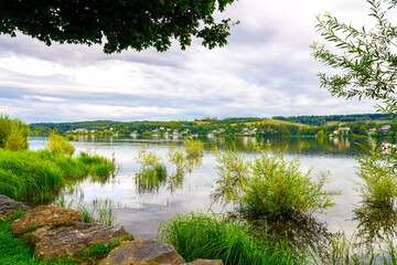 View of the Möhnesee and the surrounding landscape in the evening. Nature near Körbecke.
