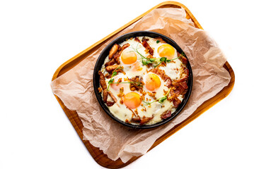 Fried eggs on a frying pan isolated on white background