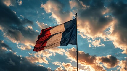 Obraz premium Flag of France. French tricolor against a blue sky.