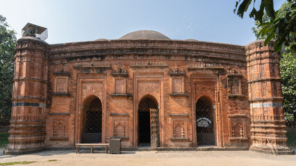 Landscape view of the facade of ancient brick and terracotta Khania Dighi mosque aka Chamchika or...