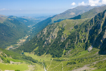 Fototapeta na wymiar The Valley of Espone in the middle of the mountains and its green countryside , in Europe, in France, Occitanie, in the Hautes-Pyrenees, in summer, on a sunny day.