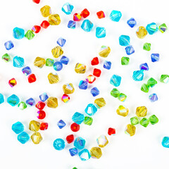 Multi-colored beads on a white background