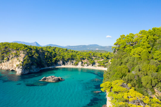 Alonaki Fanariou sandy beach and its green rocky cliffs , in Europe, Greece, Epirus, towards Igoumenitsa, by the Ionian sea, in summer, on a sunny day.