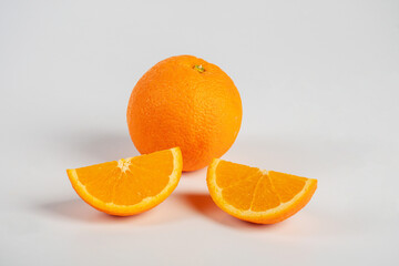 Orange slice isolate. Orange fruit half and slice set on white background.