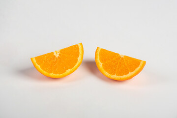 Orange slice isolate. Orange fruit half and slice set on white background.