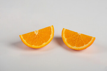 Orange slice isolate. Orange fruit half and slice set on white background.