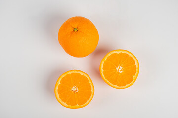 Orange slice isolate. Orange fruit half and slice set on white background.