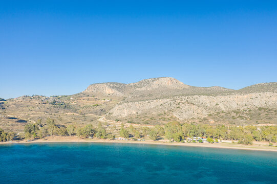 Paralia karathona Beach on arid rocky coast and countryside, Europe, Greece, Peloponnese, Argolis, Nafplion, Myrto seashore, in summer on a sunny day.