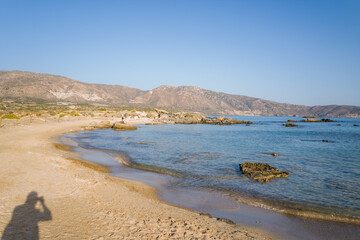 The sandy beach and its heavenly colored water, in Europe, Greece, Crete, Elafonisi, By the Mediterranean Sea, in summer, on a sunny day.