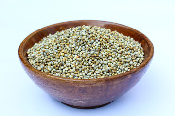 Organic Pearl millet or bajra in a wooden bowl close-up view 
