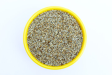 Organic Pearl millet or bajra in a bowl on white background  top view 
