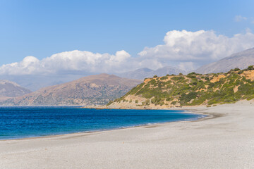 Fototapeta na wymiar Triopetra Beach and the surrounding mountains, in Europe, in Greece, in Crete, towards Rethymno, At the edge of the Mediterranean Sea, in summer, on a sunny day.