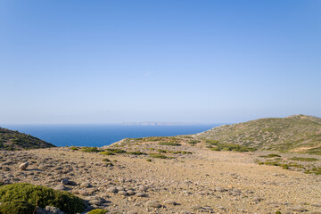 Fototapeta na wymiar The arid countryside among the mountains , in Europe, Greece, Crete, towards Sitia, By the Mediterranean sea, in summer, on a sunny day.
