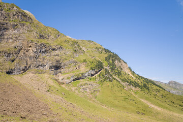 The barren rocky mountains in the middle of the countryside , Europe, France, Occitanie,...