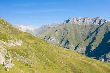 The Mountains around Gavarnie Gedre in the arid green countryside , Europe, France, Occitanie,...
