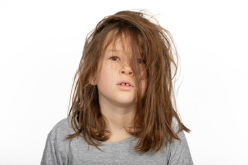 Grumpy Christmas Morning: Portrait of Young Girl with a Bad Hair Day on White Background