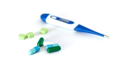 Pictures of drug and tooling of fever measuring higher temperature.