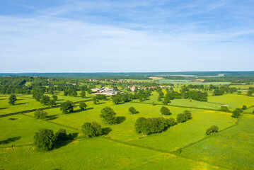 Fototapeta na wymiar A French village in the green countryside in Europe, France, Burgundy, Nievre, Cuncy les Varzy, towards Clamecy, in Spring, on a sunny day.