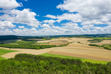 Fototapeta na wymiar The countryside with its forests and green fields in Europe, France, Burgundy, Nievre, towards Chateau Chinon, in summer, on a sunny day.