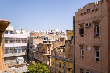 An old house in the city center in Asia, India, Rajasthan, Jaipur, in summer on a sunny day.