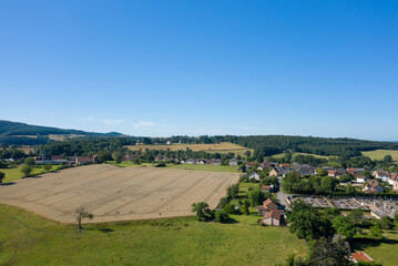 Obraz premium A traditional village old seaside resort in the middle of the countryside in Europe, France, Burgundy, Nievre, Saint-Honoré-les-Bains, towards Chateau Chinon, in summer on a sunny day.