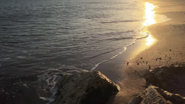 Beach with wave and sands on sunset Black Sea diagonally composition