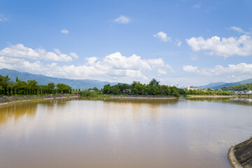 The Nam Rom river in the middle of the city and its quays towards the market, in Asia, Vietnam, Tonkin, Dien Bien Phu, in summer, on a sunny day.