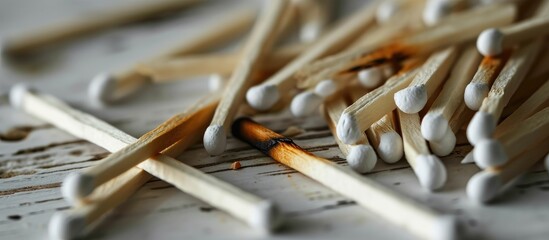 White wooden matches with striker. - obrazy, fototapety, plakaty