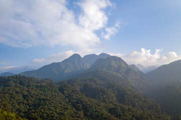 The Fan Si Pan massif and its green mountains, in Asia, in Vietnam, in Tonkin, towards Sapa, in summer, on a sunny day.