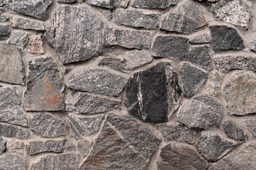 textured stone background made of natural gray stone