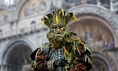the splendid costume in front of the Basilica of San Marco in Venice