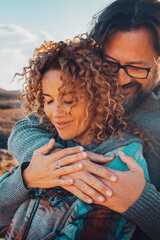 Happy young couple in love hugging outdoors with tenderness and relationship. Concept of travel...