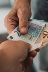 Close up of people exchanging cash banknote money. Concept of giving and taking euros. Economy and business. Present and loan back. Banking financial. Paying bills or credit action. One man give money - obrazy, fototapety, plakaty