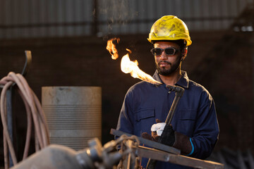Portrait of Male welder working at factory 